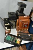 TWO MAGIC LANTERN PROJECTORS AND FOUR WOODEN BOXES OF ASSORTED 3¼ LANTERN SLIDES, the larger