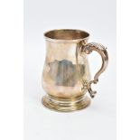 A SILVER GEORGE III TANKARD, of a plain polished design, bell shaped body on a circular base with
