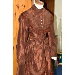 A SECOND HALF 19TH CENTURY BROWN SILK TWO PIECE DAY DRESS, with fringing and pleats to the bodice