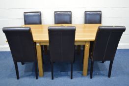 A LAURA ASHLEY GOLDEN OAK SQUARE DINING TABLE that folds over to extend on square block legs