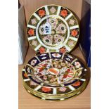SIX ROYAL CROWN DERBY IMARI 1128 PATTERN TEA PLATES AND A 2451 PATTERN SAUCER, three with date