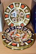 SIX ROYAL CROWN DERBY IMARI 1128 PATTERN TEA PLATES AND A 2451 PATTERN SAUCER, three with date