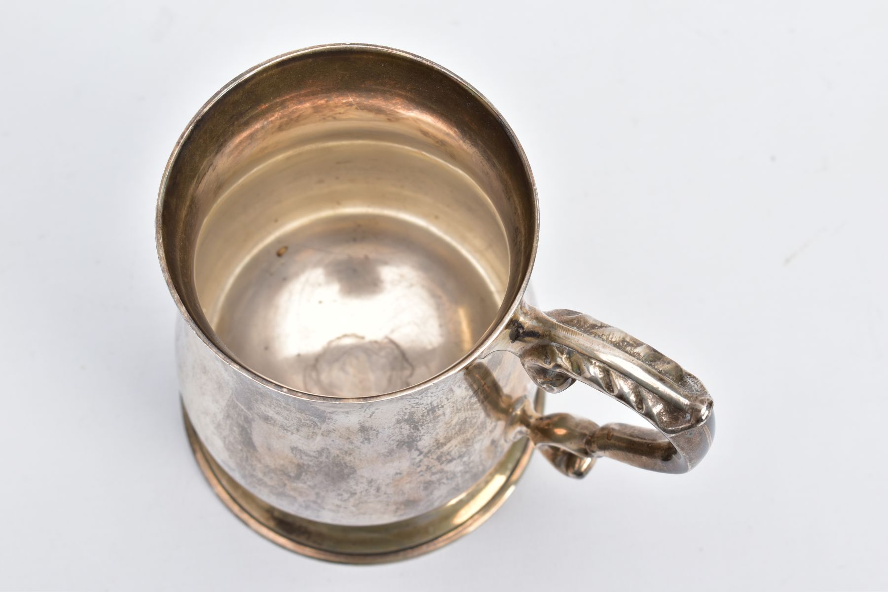 A SILVER TANKARD, of a plain polished design, bell shaped body on a circular base with a foliate - Image 5 of 6