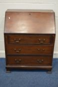 AN EDWARDIAN MAHOGANY BUREAU with a fitted interior three exterior drawers on bracket feet width