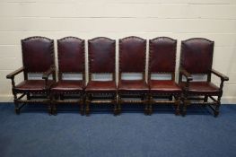 A SET OF SIX REPRODUCTION OAK DINING CHAIRS with buttoned oxblood leather seat pads and back on a