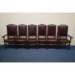 A SET OF SIX REPRODUCTION OAK DINING CHAIRS with buttoned oxblood leather seat pads and back on a