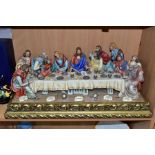 A CAPODIMONTE FIGURE GROUP OF THE LAST SUPPER BY CORTESE, mounted on a giltwood base, marked towards
