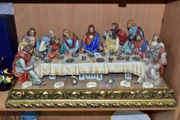 A CAPODIMONTE FIGURE GROUP OF THE LAST SUPPER BY CORTESE, mounted on a giltwood base, marked towards