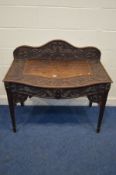A LATE 19TH/EARLY 20TH CENTURY CARVED OAK SIDE TABLE with foliate decoration raised back and