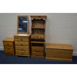 A QUANTITY OF PINE FURNITURE to include a tall chest of four drawers two pine bedside cabinets