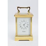 A WOODFORD ENGLISH BRASS STRIKING CARRIAGE CLOCK, white dial with Brequet style hands, Roman