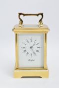 A WOODFORD ENGLISH BRASS STRIKING CARRIAGE CLOCK, white dial with Brequet style hands, Roman