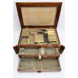 A COMPLETE CANTEEN OF WALKER & HALL CUTLERY, the wooden canteen with a brass crest to the lid