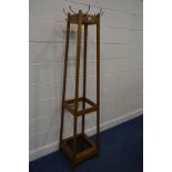 A MID TO LATE 20TH CENTURY GOLDEN OAK HAT/COAT STAND with eight hooks and tin tray 41cm squared x