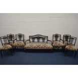A EDWARDIAN MAHOGANY SEVEN PIECE SALON SUITE comprising a three seater settee 143cm pair of open arm
