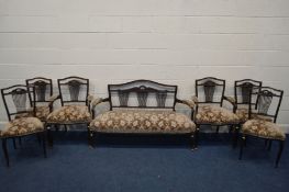 A EDWARDIAN MAHOGANY SEVEN PIECE SALON SUITE comprising a three seater settee 143cm pair of open arm