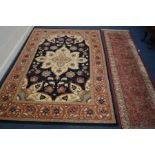 A LATE 20TH CENTURY YATZ CARPET RUNNER 300cm x 79cm together with a black and brown rug (2)