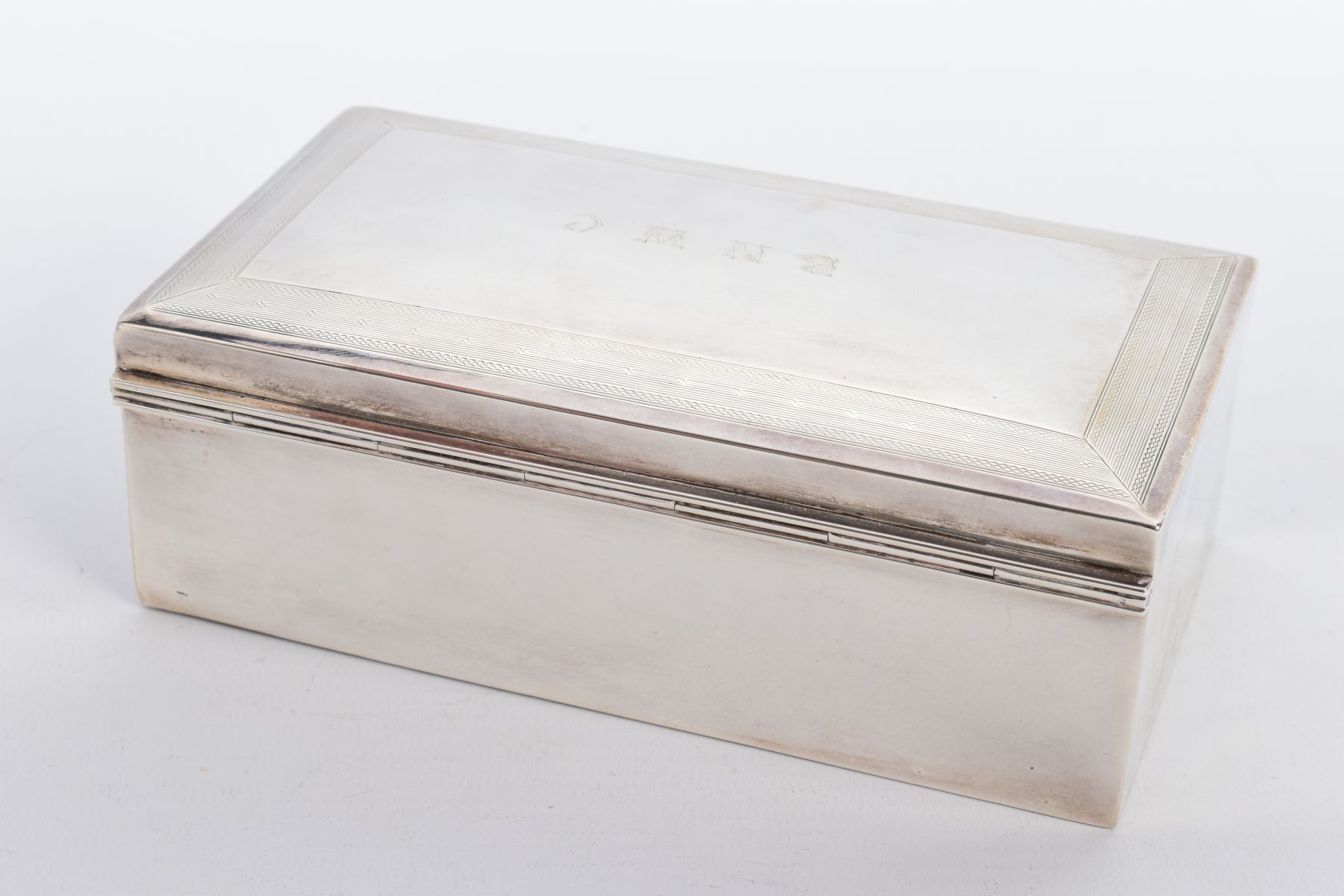 A SILVER LINED CIGARETTE BOX, of a plain polished design, engraved to the lid 'B.N.W.C.' within an - Image 2 of 6