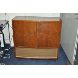 A BUSH RG66 VALVE RADIOGRAM in walnut cabinet ( PAT pass and radio working turntable needs