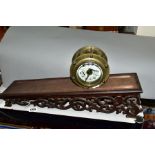 A LATE 19TH/EARLY 20TH CENTURY BRASS CASED ROLLING CLOCK, the 7.5cm enamel dial with swag decoration