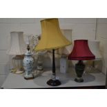 SEVEN VARIOUS TABLE LAMPS to include an early 20th century mahogany column lamp two onyx lamps and