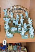 A TUDOR MINT 'ICE DRAGONETS' DISPLAY STAND AND SEVENTEEN DRAGON FIGURES, including Greedy Guts,