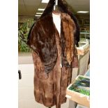 A LADIES FUR COAT, approximate size 14/16, a dark fur stole with head, tail and legs, mink stole