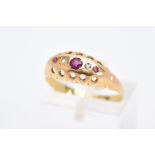A YELLOW METAL FIVE STONE RUBY AND DIAMOND RING, designed as a row of three circular cut rubies