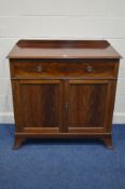 AN EARLY 20TH CENTURY MAHOGANY PANELLED TWO DOOR CABINET with a single drawer on bracket feet