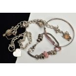 FOUR WHITE METAL BRACELETS, to include a white metal charm bracelet with seven charms such as two