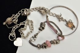 FOUR WHITE METAL BRACELETS, to include a white metal charm bracelet with seven charms such as two