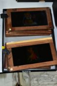 TEN MAGIC LANTERN SLIPPING SLIDES, in wooden frames, subjects include dancers and comical