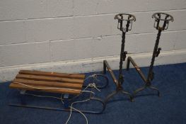 A PAIR OF WROUGHT IRON FIRE DOGS together with vintage sleigh (3)