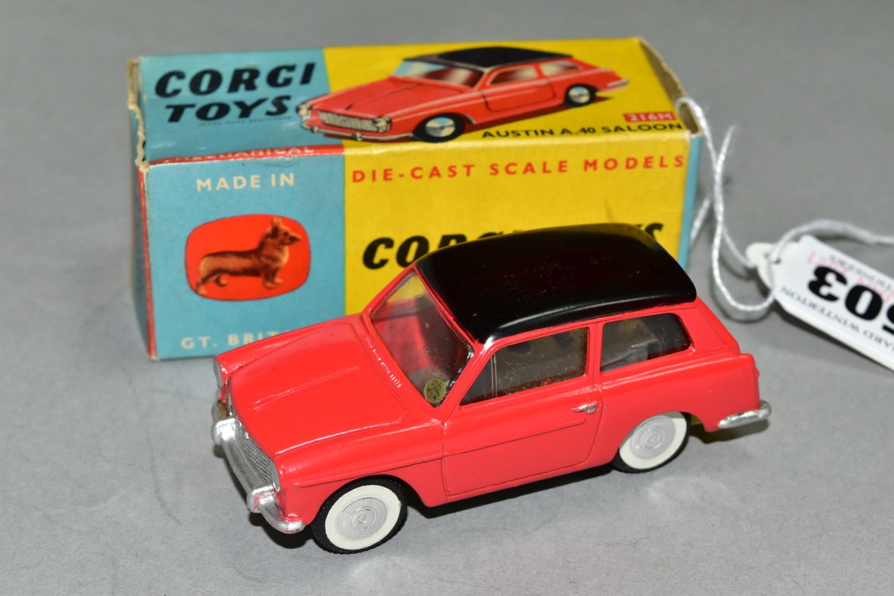 A BOXED CORGI TOYS AUSTIN A40, No 216M, red body with black roof, flat spun hubs with self-