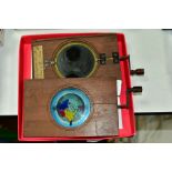 TWO HAND PAINTED MECHANICAL MAGIC LANTERN SLIDES, 'A diagram to prove the earths rotundity', (