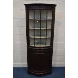 A MODERN MAHOGANY BOWFRONT FLOOR STANDING CORNER CUPBOARD width 74cm x depth 50cm x height 183cm (