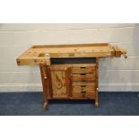 A SJOBERGS OF SWEDEN WORKBENCH comprising of two vices one cupboard and five drawers 136cm wide 76cm