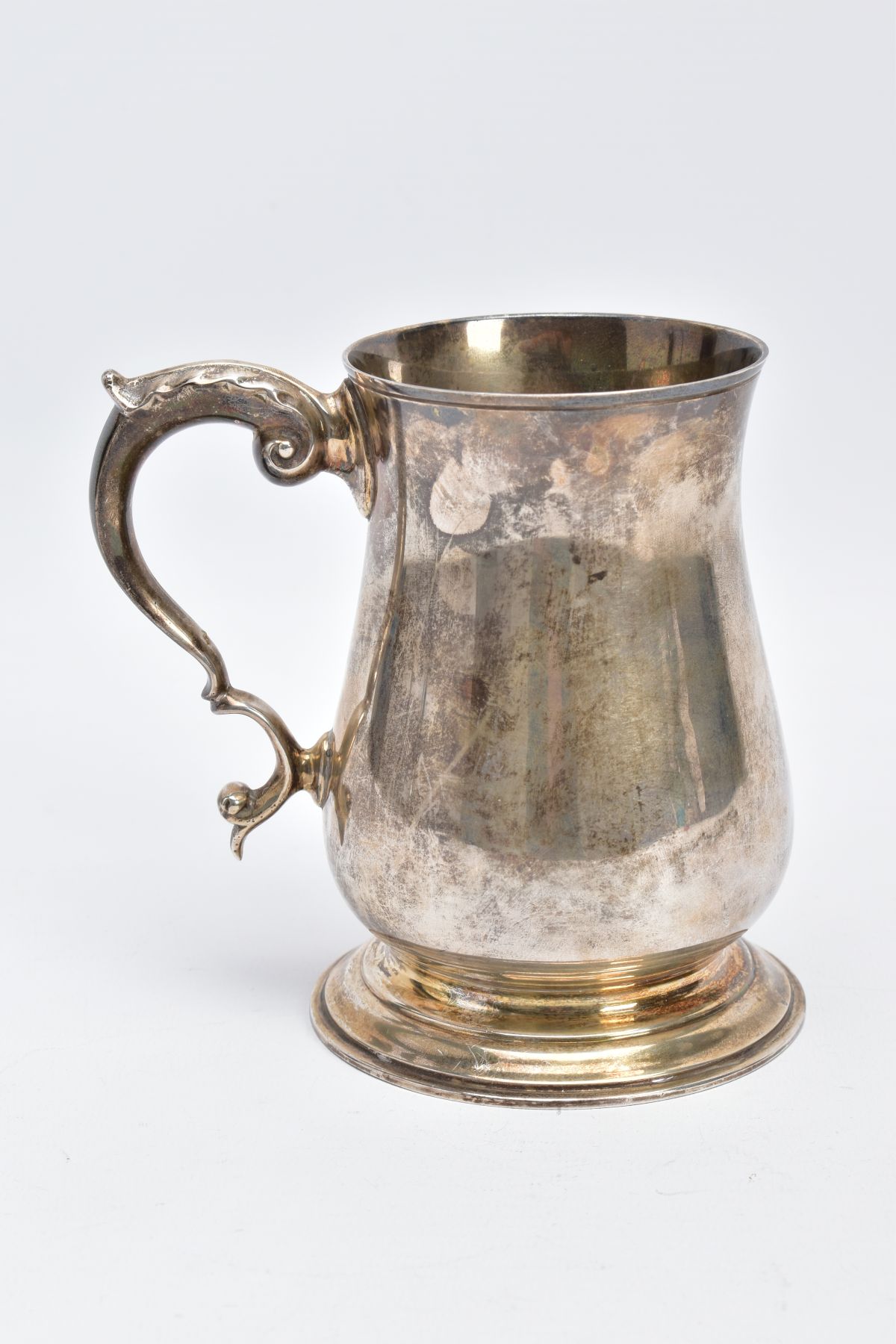 A SILVER TANKARD, of a plain polished design, bell shaped body on a circular base with a foliate - Image 2 of 6