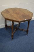 AN EDWARDIAN ROSEWOOD OCTAGONAL CENTRE TABLE on turned legs united by a cross stretcher with