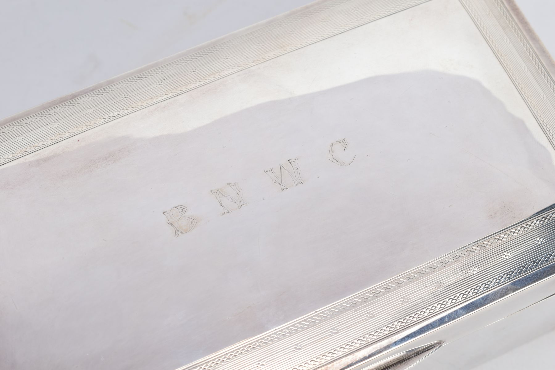 A SILVER LINED CIGARETTE BOX, of a plain polished design, engraved to the lid 'B.N.W.C.' within an - Image 5 of 6