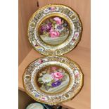 A PAIR OF STEVENS & HANCOCK PORCELAIN CABINET PLATES, the border with gilt decoration and three