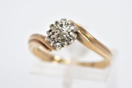 A 9CT GOLD DIAMOND CLUSTER RING, the cluster set with single cut diamonds (three are missing) within