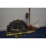 A BRASS FAN FIRESCREEN together with a brass fender width 125cm, brass fire dogs along with three