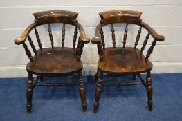 A PAIR OF STAINED OAK CAPTAINS CHAIRS