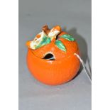 A CLARICE CLIFF BIZARRE PRESERVE POT AND COVER OF ORANGE FORM, the lid moulded with flowers, leaf