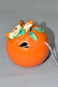 A CLARICE CLIFF BIZARRE PRESERVE POT AND COVER OF ORANGE FORM, the lid moulded with flowers, leaf