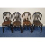 A SET OF FOUR EARLY TO MID 20TH CENTURY STAINED OAK AND BEECH SPINDLE BACK KITCHEN CHAIRS