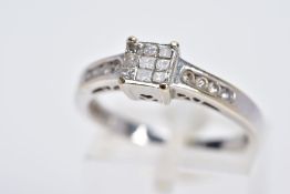 AN 18CT WHITE GOLD DIAMOND RING, designed with a central raised square panel set with nine