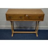 AN ERCOL WINSOR BLONDE ELM AND BEECH SIDE TABLE with two drawers on four shaped leg support united