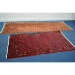 A TEKKE ORANGE CARPET RUNNER 292cm x 94cm together with a red tekke ground rug 197cm x 97cm and